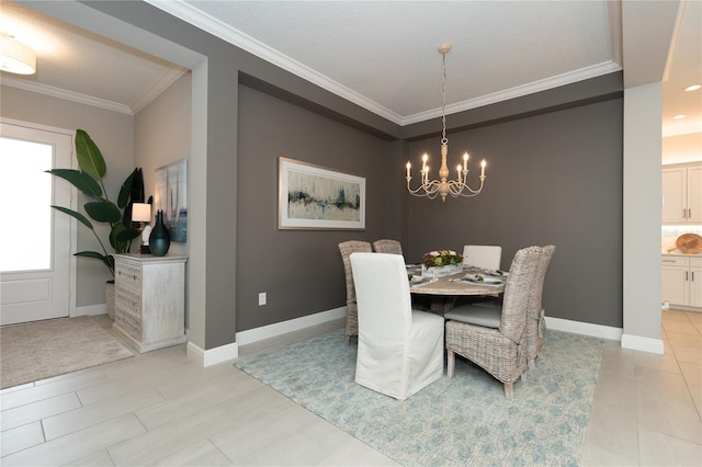 dining space with crown molding and a chandelier