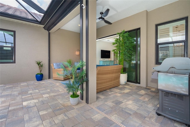 view of patio featuring ceiling fan