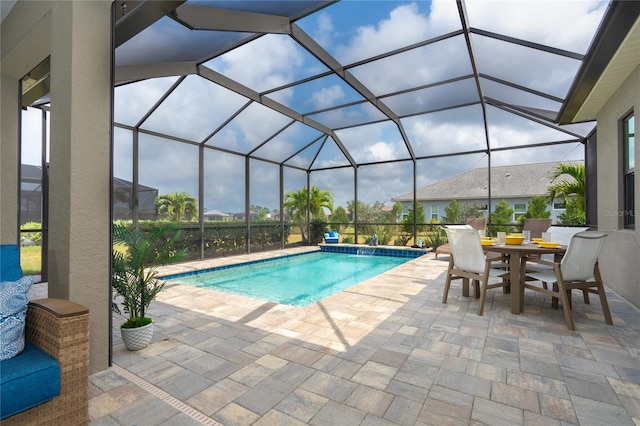 view of pool with a lanai and a patio