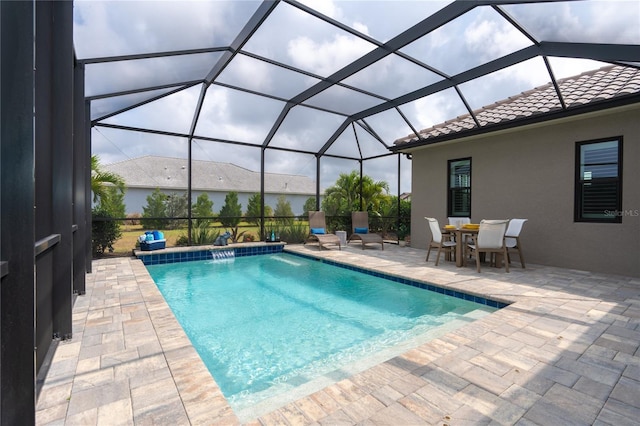 view of pool with a lanai and a patio