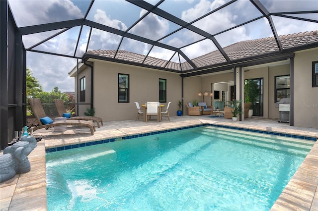 view of swimming pool featuring a lanai, a patio area, and an outdoor hangout area