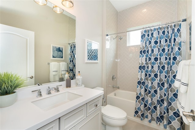 full bathroom featuring tile patterned floors, shower / tub combo with curtain, vanity, and toilet