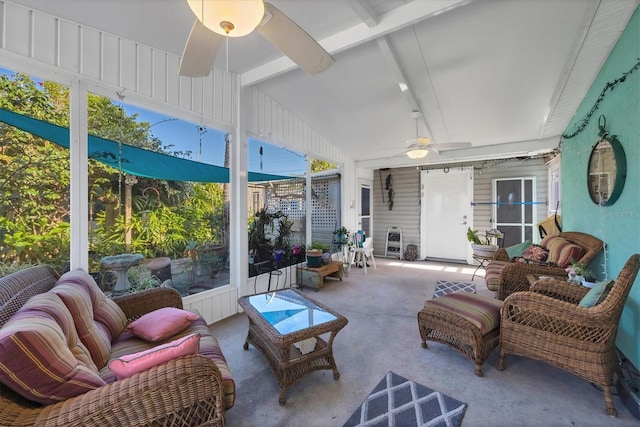 sunroom / solarium with ceiling fan and lofted ceiling with beams