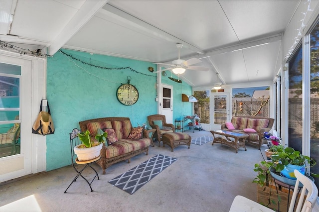 sunroom / solarium with lofted ceiling with beams and ceiling fan