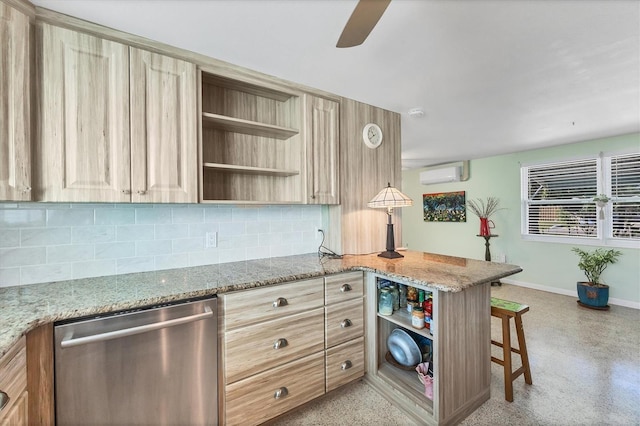 kitchen featuring a wall mounted air conditioner, stainless steel dishwasher, tasteful backsplash, light stone counters, and kitchen peninsula