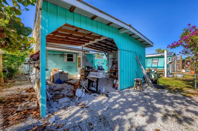 back of house with an outdoor structure