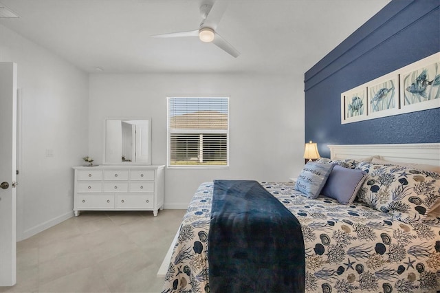 bedroom featuring a ceiling fan and baseboards