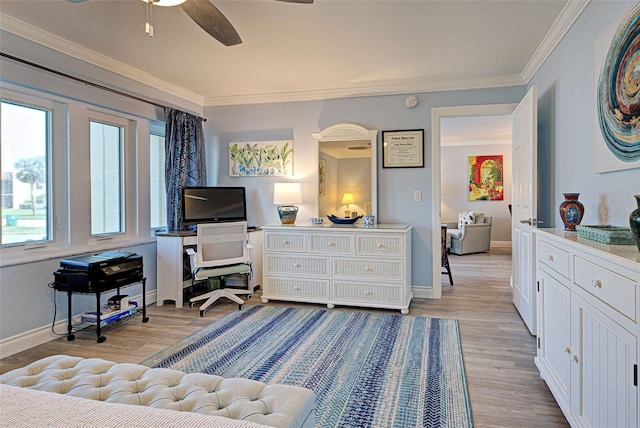 bedroom with light hardwood / wood-style flooring, ceiling fan, and crown molding