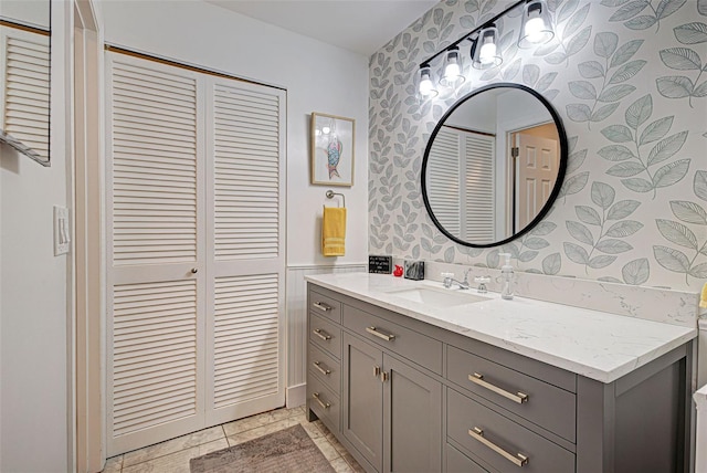 bathroom with tile patterned flooring and vanity