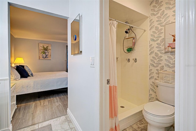 bathroom with wood-type flooring, toilet, ornamental molding, and walk in shower