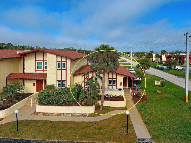 view of front of house with a front lawn