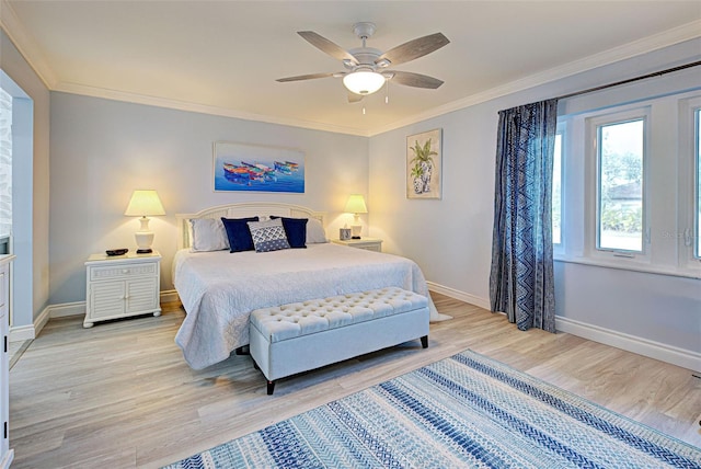 bedroom with ceiling fan, ornamental molding, and light wood-type flooring