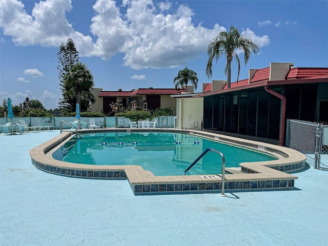 view of swimming pool featuring a patio area