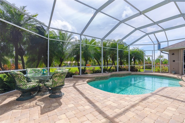 view of pool featuring a lanai and a patio area