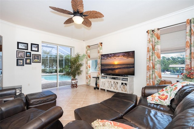 living room featuring ceiling fan, light tile patterned flooring, and ornamental molding