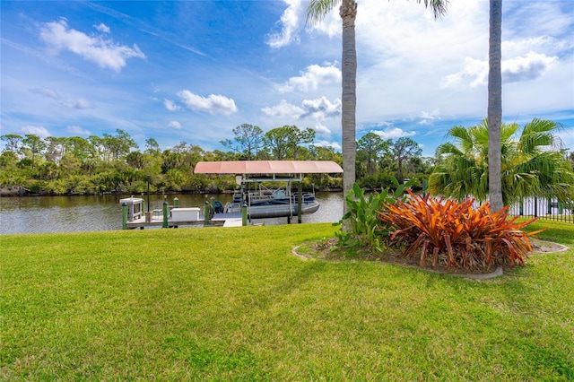 dock area featuring a yard and a water view