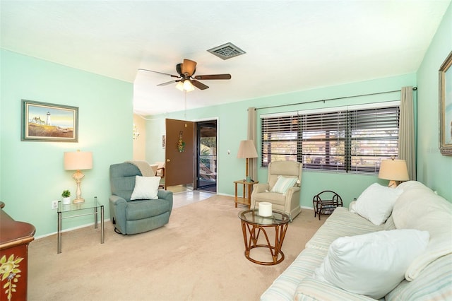 living room with ceiling fan and light carpet