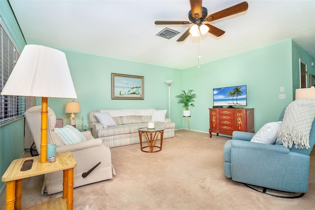 living room with carpet and ceiling fan