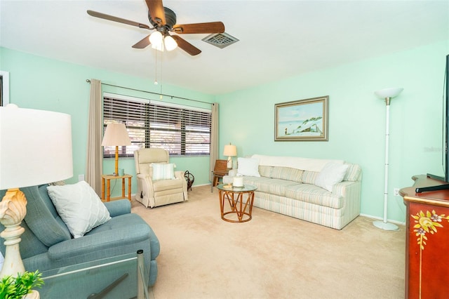 living room featuring ceiling fan and light colored carpet