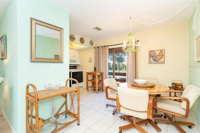 dining area with light tile patterned floors and a notable chandelier