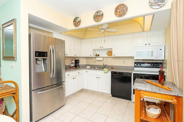 kitchen featuring white cabinetry, sink, ceiling fan, white appliances, and light tile patterned flooring