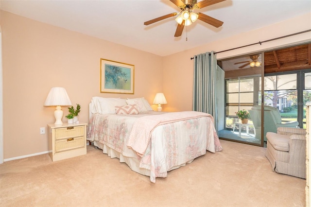 bedroom featuring access to outside, ceiling fan, and carpet