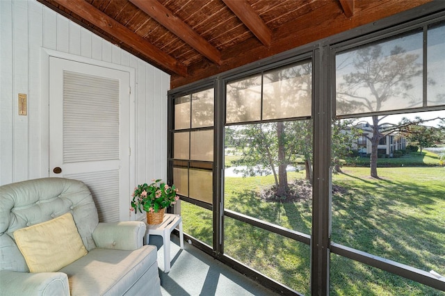 sunroom with vaulted ceiling with beams and wood ceiling