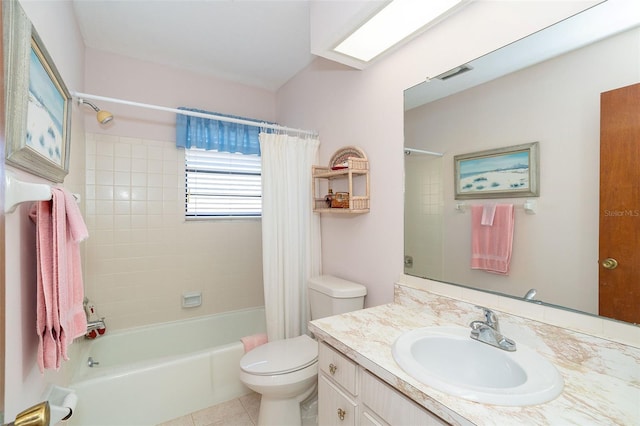 full bathroom with tile patterned flooring, vanity, toilet, and shower / bath combo with shower curtain