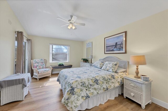 bedroom featuring light wood-type flooring and ceiling fan