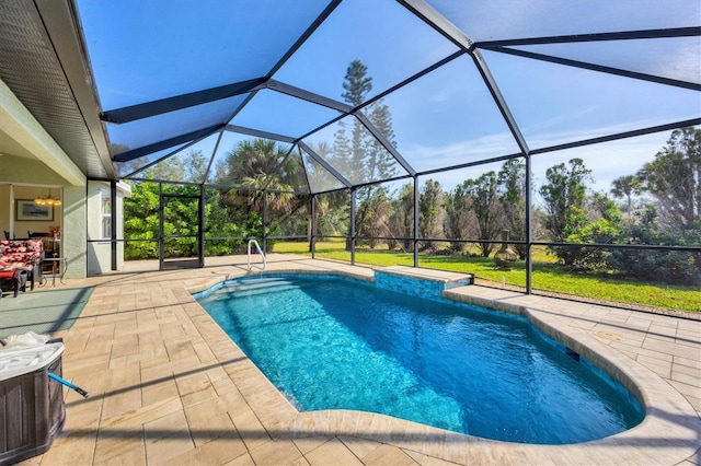 view of pool with a lanai and a patio area