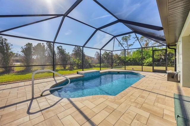 view of swimming pool with a patio area and glass enclosure