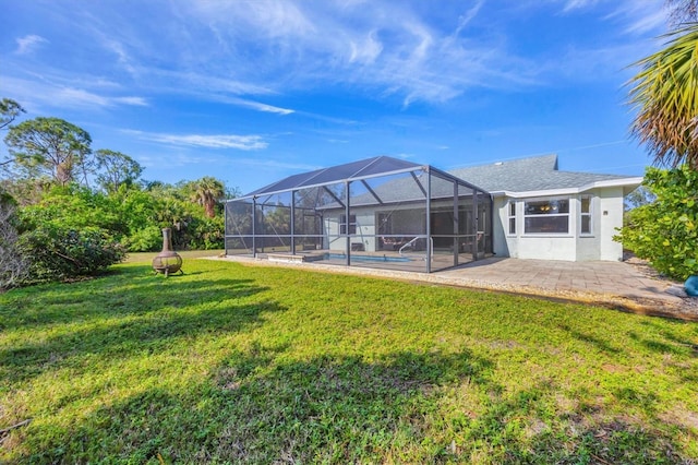 view of yard with a lanai and a patio