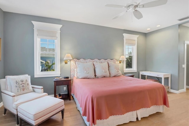 bedroom featuring light hardwood / wood-style floors and ceiling fan