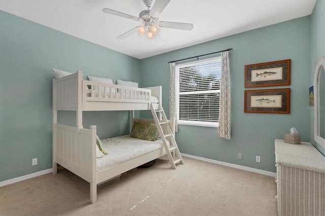 bedroom with ceiling fan and light carpet