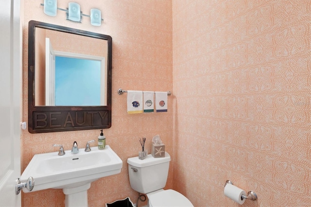 bathroom featuring sink and toilet