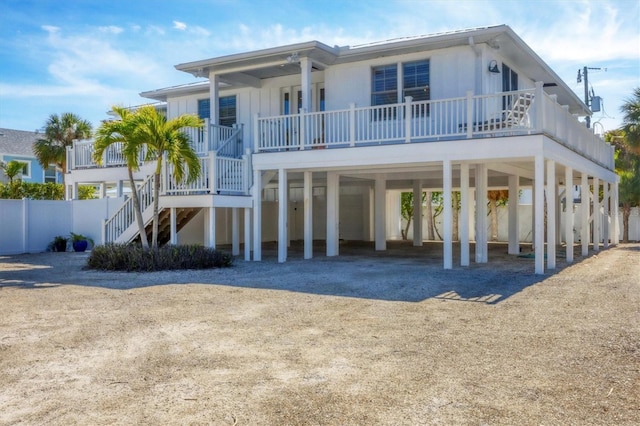 rear view of house with a carport