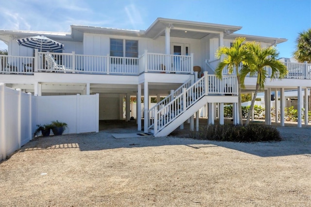 back of property featuring covered porch