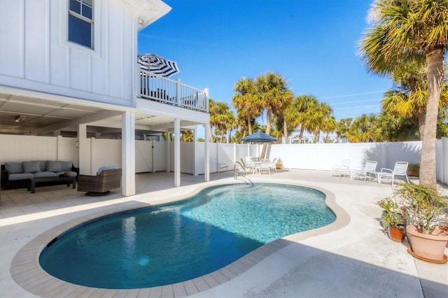 view of swimming pool featuring outdoor lounge area and a patio