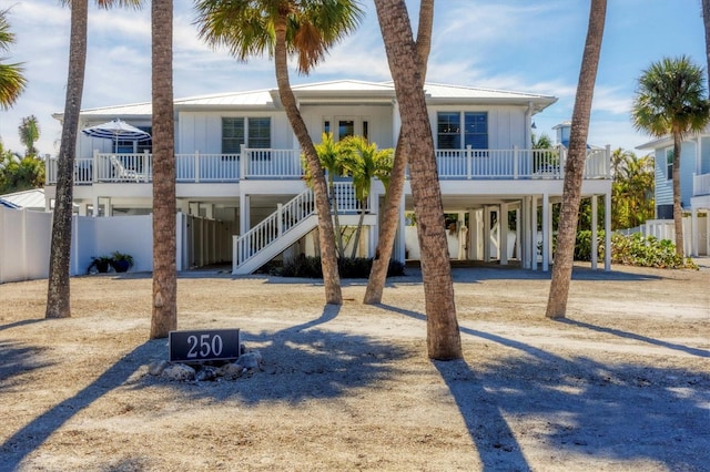 coastal home with a carport and covered porch