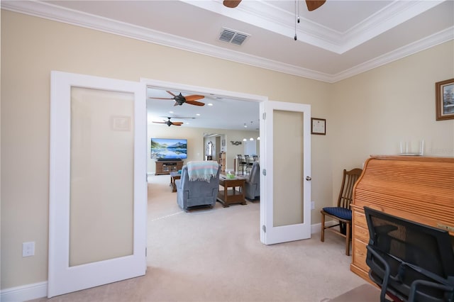 sitting room featuring ornamental molding, light colored carpet, and french doors