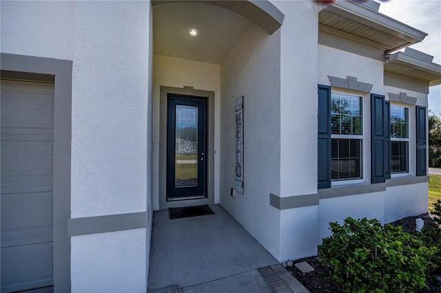 property entrance with a garage