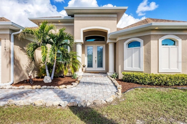 property entrance featuring french doors