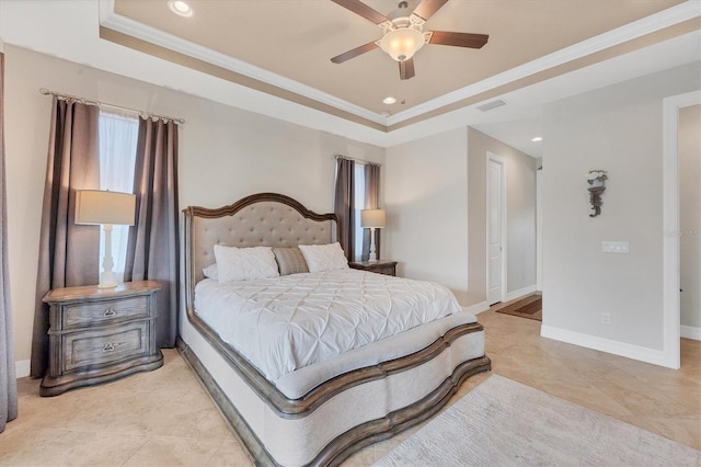 bedroom with a tray ceiling, ceiling fan, and crown molding