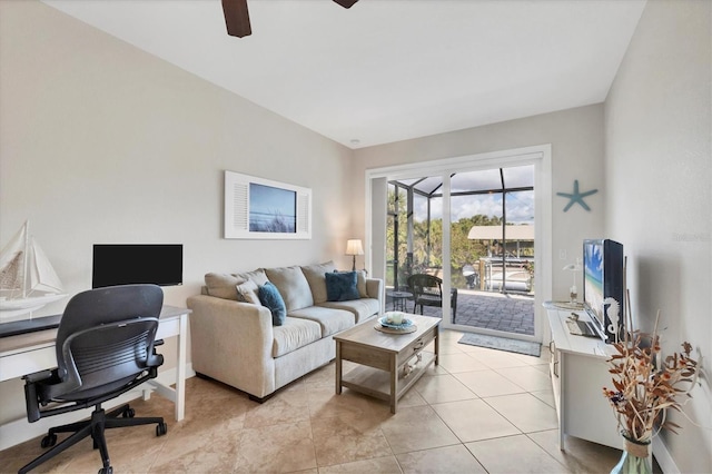 tiled living room with ceiling fan