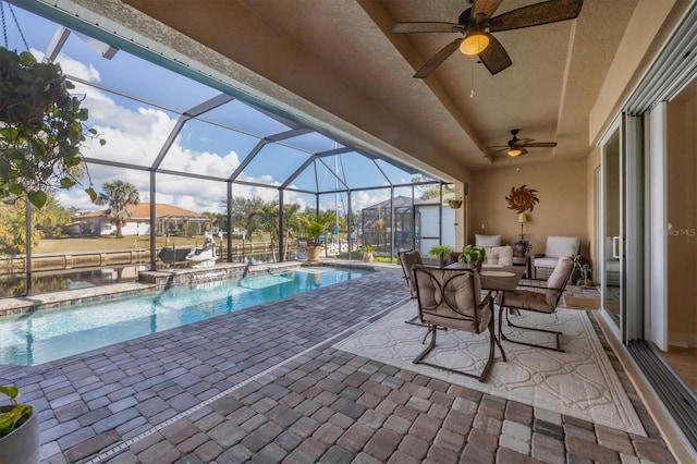 view of pool featuring a lanai and a patio