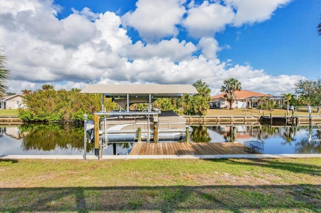 dock area with a water view and a lawn