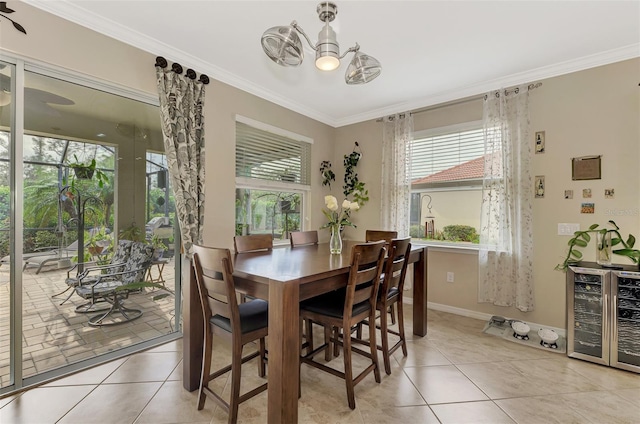 dining room with light tile patterned floors, beverage cooler, ornamental molding, and ceiling fan