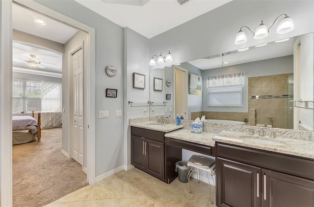 bathroom featuring tile patterned floors, ceiling fan, vanity, and walk in shower