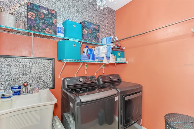 laundry room featuring separate washer and dryer and sink