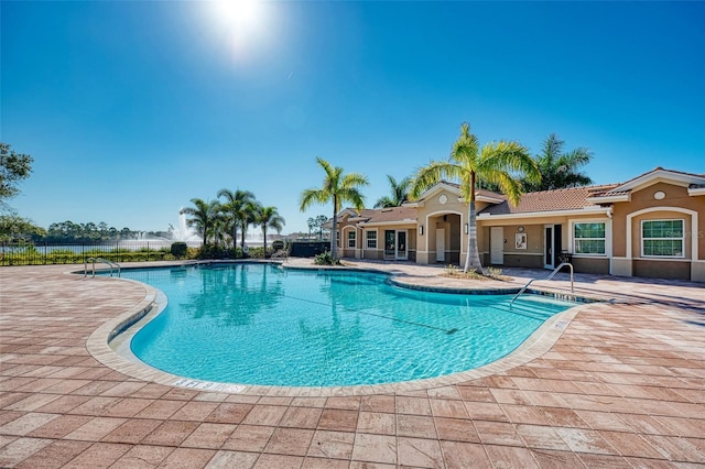 view of swimming pool with a patio